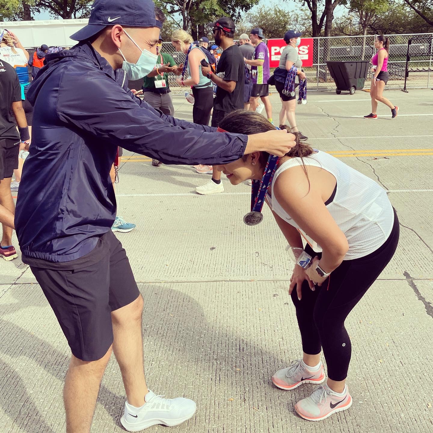 Bensenville resident runs Chicago Marathon first time ever; Brother from Addison urges her on, presents her with medal